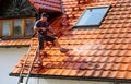 Roof cleaning with high pressure cleaner Royalty Free Stock Photo