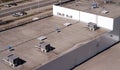 Roof of a commercial building with a external units of the commercial air conditioning and ventilation systems