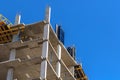 Roof of construction site of new multi-storey residential building. Industrial construction, industry equipment and Royalty Free Stock Photo