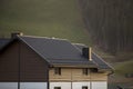 Roof of cottage with siding walls, brown shingle roof and high c Royalty Free Stock Photo