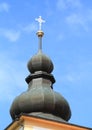 Roof with cross of church in Chroboly