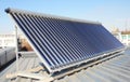 Roof with energy saving and energy efficiency. Metal Roofing Construction with solar panels and solar water heater SWH system.