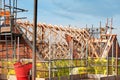 Roof erection is in progress. Trusses installed on top of new house Royalty Free Stock Photo