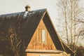 Roof and facade with a window of an old wooden country house Royalty Free Stock Photo