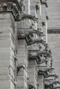 Roof figures of scary gargoyles at main facade of Notre Dame de Paris cathedral in Paris, France, closeup, details Royalty Free Stock Photo