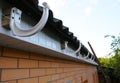 Roof gutter holders installation. House rain gutter holders installing