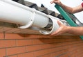 Roof gutter repair. Guttering repair. Roofer contractor repair house rain gutter pipeline