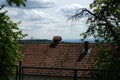 Roof of a house with forest and sea on the background Royalty Free Stock Photo