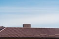 The roof of the house is made of red metal tiles. Concept installing house roof. Modern new house Royalty Free Stock Photo