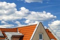 Roof of house with windows and yellow roof tiles Royalty Free Stock Photo