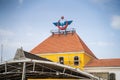 The roof of the Izmir Basmane train station and the The State Railways of the Republic of Turkey (TCDD) logo.