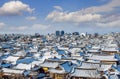 Roof of Jeonju traditional Korean village covered with snow. Royalty Free Stock Photo