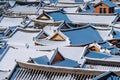 Roof of Jeonju traditional Korean village covered with snow, Jeonju Hanok village in winter, Korea.