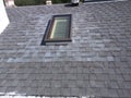 Roof leak repairs and skylight installation on residential shingle roof