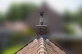 Roof made of ceramic tiles and a brick chimney.