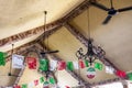 Roof of a Mexican open terrace with flags and typical decoration with fans of Mexico