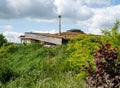 Roof of modern self sufficient earth house with soil against the walls Royalty Free Stock Photo