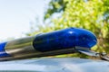 The roof-mounted lightbar of police car