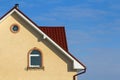 Roof of a new built house with nice window and chimney. Royalty Free Stock Photo