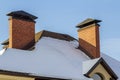 Roof of a new built house with nice window and chimney. Royalty Free Stock Photo