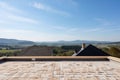 roof of new house, with view of distant mountaires and clear blue skies