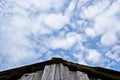 The roof of the old barn and the sky with clouds Royalty Free Stock Photo
