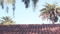 Roof of old mexican house tiled, ceramic clay tiles. Suburban California garden. Royalty Free Stock Photo