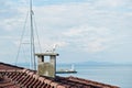 Roof with orange tile houses of old port Nesebar, Bulgaria. Seagull sit on chimney Royalty Free Stock Photo