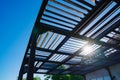 Roof over sun loungers on the beach made of wooden slats. a blue sky. Royalty Free Stock Photo