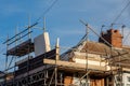 Roof replacement work being carried out, with scaffolding up. Typical UK semi detached house Royalty Free Stock Photo