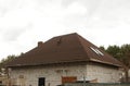 Roof Shingles - Roofing. Asphalt Roofing Shingles. Urban house or building. Bitumen tile roof. Unfinished chimney system Royalty Free Stock Photo