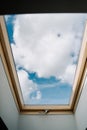 Roof Skylight Window and Blue Sky with Clouds Royalty Free Stock Photo