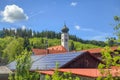 Roof with solar batteries and spire