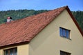 The roof of this square ceramic tile is red. The old type of roof covering in rich houses of the 19th centur Royalty Free Stock Photo