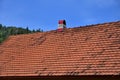 The roof of this square ceramic tile is red. The old type of roof covering in rich houses of the 19th centur Royalty Free Stock Photo