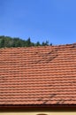 The roof of this square ceramic tile is red. The old type of roof covering in rich houses of the 19th centur Royalty Free Stock Photo