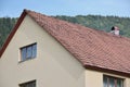 The roof of this square ceramic tile is red. The old type of roof covering in rich houses of the 19th century Royalty Free Stock Photo