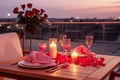 Roof terrace with festive table setting for romantic dinner by candlelight with city view. Decorations for Valentine Royalty Free Stock Photo