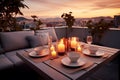 Roof terrace with festive table setting for romantic dinner by candlelight with city view. Decorations for Valentine Royalty Free Stock Photo