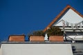 Roof terrace with terracotta flower box behind is the gable Royalty Free Stock Photo