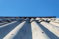 Roof tiles against a blue sky without clouds.