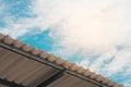 Roof tiles and blue sky with clouds Royalty Free Stock Photo