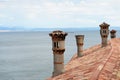 Roof tiles and chimneys on Duino castle. Royalty Free Stock Photo