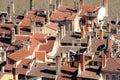 The roof tiles and chimneys of houses in Lyon`s old quarter