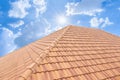 Roof tiles and sky sunlight. Roofing Contractors concept Installing Royalty Free Stock Photo