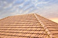 Roof tiles and sky sunlight.Roofing Contractors concept Installing House roof. Royalty Free Stock Photo