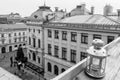 Roof-top view of a lantern over a small square. Horizontal black