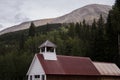 The Roof of the town Hall and Jail in St. Elmo in Colorado with mountains overlooking