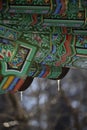 Roof of traditional Korean houses with icicles, Korean ancient architecture with icicles, snow, trees, and Korean-style houses Royalty Free Stock Photo