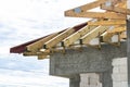 Roof trusses connected to the roof truss, not covered with a roof, with a steel I-beam instead of a corner rafter. Royalty Free Stock Photo